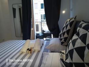 Posteľ alebo postele v izbe v ubytovaní Dimora50 Apartament