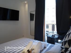 Posteľ alebo postele v izbe v ubytovaní Dimora50 Apartament