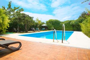 an image of a swimming pool at a house at Hotel Doñana Blues in Matalascañas