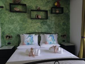 Łóżko lub łóżka w pokoju w obiekcie B&B Medusa House Gallipoli