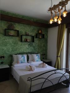 Łóżko lub łóżka w pokoju w obiekcie B&B Medusa House Gallipoli