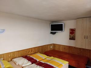 Posteľ alebo postele v izbe v ubytovaní Apartmány Potok