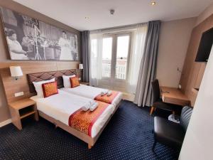 Postel nebo postele na pokoji v ubytování Hotel Washington