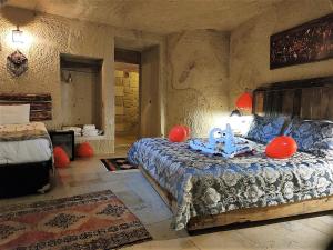 Postel nebo postele na pokoji v ubytování Nox Cave Hotel Special Class