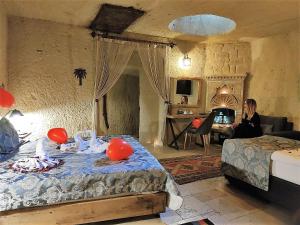 Postel nebo postele na pokoji v ubytování Nox Cave Hotel Special Class