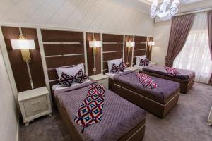 Кровать или кровати в номере Shaxzoda Elite Hotel