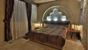 Postel nebo postele na pokoji v ubytování Nox Cave Hotel Special Class