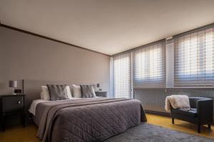Katil atau katil-katil dalam bilik di Centrale Venice Apartments