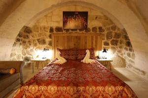 Postel nebo postele na pokoji v ubytování Nox Cave Hotel Special Class