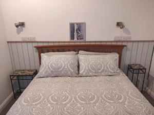 Ліжко або ліжка в номері Headingley Hideaway