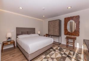 Un pat sau paturi într-o cameră la Casa das Margaridas
