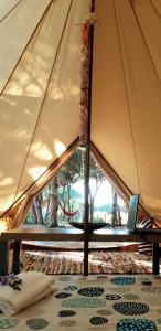 A bed or beds in a room at The PineForest Cabin