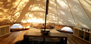 A bed or beds in a room at The PineForest Cabin