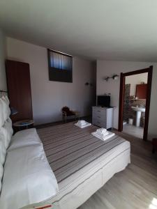 Postel nebo postele na pokoji v ubytování Cuscino e Cappuccino B&B