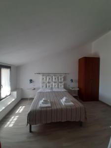 Postel nebo postele na pokoji v ubytování Cuscino e Cappuccino B&B