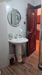 a bathroom with a sink and a mirror at Apartmani Mašić Trebinje in Trebinje +24 photos