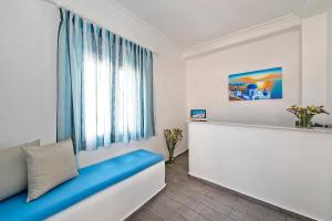 TV a/nebo společenská místnost v ubytování Alizea Villas & Suites
