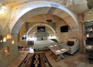 Postel nebo postele na pokoji v ubytování Nox Cave Hotel Special Class