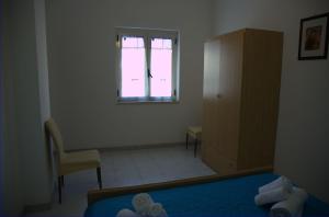 A bed or beds in a room at Giulymar