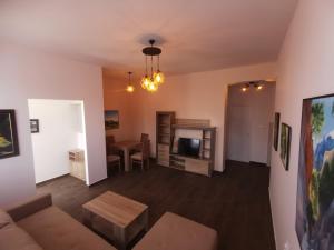 a living room with a couch and a table at Crown Apartments in Skopje