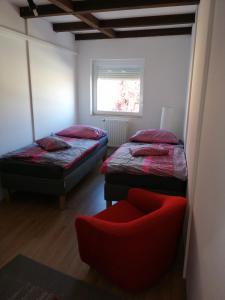 A bed or beds in a room at Szent György Vendégház