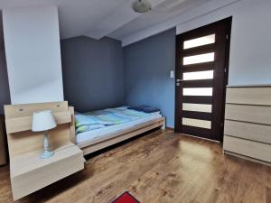 En eller flere senger på et rom på Sea&Forest Pogorzelica Apartament Platynowy