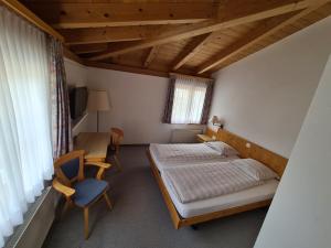Postel nebo postele na pokoji v ubytování Hotel Stätzerhorn