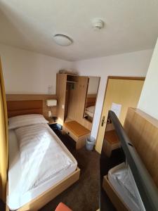Postel nebo postele na pokoji v ubytování Hotel Stätzerhorn