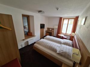 Postel nebo postele na pokoji v ubytování Hotel Stätzerhorn