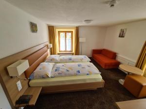 Postel nebo postele na pokoji v ubytování Hotel Stätzerhorn