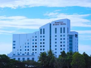 a white building with a sign on top of it at Parkcity Everly Hotel Bintulu in Bintulu