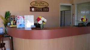 a counter with flowers sitting on top of it at Dalby Mid Town Motor Inn in Dalby