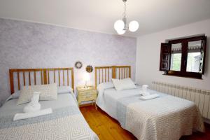 Un pat sau paturi într-o cameră la CASA RURAL EL ULTIMO CARRETERO