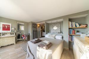 a bedroom with a bed with two pillows on it at Villa La Lavande in Valbonne +33 photos