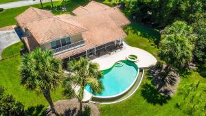 an overhead view of a house with a swimming pool at SWISS 41 - Golf Course in Clermont