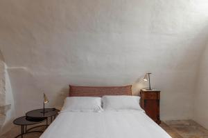 Postel nebo postele na pokoji v ubytování Il Sogno delle Benedettine