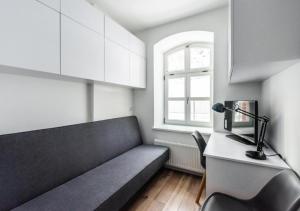 Televízia a/alebo spoločenská miestnosť v ubytovaní Apartamenty Do Studzienki 65