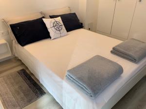 Postel nebo postele na pokoji v ubytování Apartments Lota