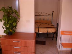 Postel nebo postele na pokoji v ubytování Hotel Villaggio Tabù
