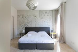 Posteľ alebo postele v izbe v ubytovaní Infinite House Guglie