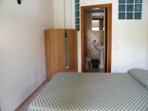 Postel nebo postele na pokoji v ubytování Hotel Villaggio Tabù