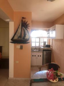 a kitchen with a sink and a table in a room at Hotel Francis Arlene Adults Only in Isla Mujeres