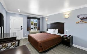 Postelja oz. postelje v sobi nastanitve 3rd Avenue Inn