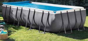 a large swimming pool in the grass in a yard at Casa Pepe de L´ullat in Deltebre