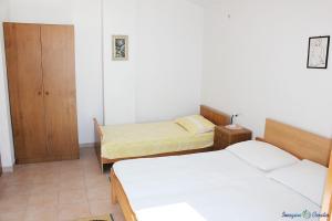 Posteľ alebo postele v izbe v ubytovaní Apartment in Pisak with sea view, balcony, air conditioning, Wi-Fi (4722-4)