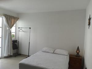 Postel nebo postele na pokoji v ubytování Milenio III B&B