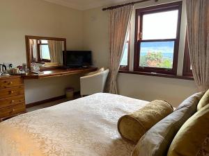 Postel nebo postele na pokoji v ubytování Ardno House B & B