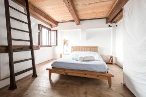 a bedroom with a bunk bed and a ladder at Lion Rooftop Apartments Venice NOVITA' in Venice