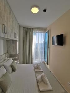 Voodi või voodid majutusasutuse Hotel MonteNino toas