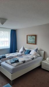 Postel nebo postele na pokoji v ubytování Holiday Apartment Davos Residence + 23 fotografií